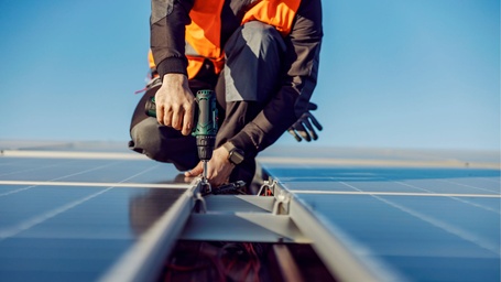 Roof technician working on a commercial roof